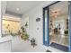 Inviting front porch leading to a modern interior, showcasing a bright, open doorway at 14314 Pleach St, Winter Garden, FL 34787