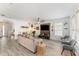 Bright living room with stylish furniture, wood-look tile, and a ceiling fan at 14314 Pleach St, Winter Garden, FL 34787