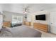 A serene main bedroom featuring a ceiling fan, carpeted floors, and a comfortable aesthetic at 14314 Pleach St, Winter Garden, FL 34787