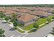 Aerial view of the home's tile roof, landscaping, and surrounding community at 1000 Blackwolf Run Rd, Davenport, FL 33896