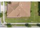 Aerial view of the home's roof and the surrounding well-manicured landscaping at 1000 Blackwolf Run Rd, Davenport, FL 33896
