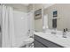 Bathroom featuring shower-tub combo and a gray vanity with quartz countertop at 1000 Blackwolf Run Rd, Davenport, FL 33896