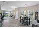 Cozy dining area with bright light, neutral walls, tile floor, and an exterior view at 1000 Blackwolf Run Rd, Davenport, FL 33896