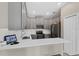 Modern kitchen featuring stainless steel appliances, subway tile backsplash, and breakfast bar at 1000 Blackwolf Run Rd, Davenport, FL 33896