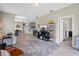 Open floor plan with views of the kitchen, dining area, and front entry at 1000 Blackwolf Run Rd, Davenport, FL 33896