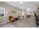 Bright living room with a large rug, two recliners, and neutral wall color at 1000 Blackwolf Run Rd, Davenport, FL 33896