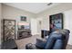 Living room features a TV, comfortable seating, and a neutral color scheme at 1000 Blackwolf Run Rd, Davenport, FL 33896