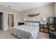 This main bedroom features a calming decor, with an ensuite bathroom located off the main room at 1000 Blackwolf Run Rd, Davenport, FL 33896