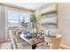 Well-appointed dining room with large windows offering ample natural light and scenic views at 1003 Cloud Ridge Ct, Mount Dora, FL 32757