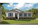 Charming single-story home with stone accents, blue shutters, and lush green lawn at 1003 Cloud Ridge Ct, Mount Dora, FL 32757