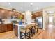 Modern kitchen featuring stainless steel appliances, granite countertops, and a large island with seating at 1003 Cloud Ridge Ct, Mount Dora, FL 32757