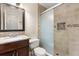 Nicely updated bathroom with a glass enclosed shower and granite topped vanity at 1208 Roma Ct, Orlando, FL 32825