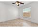Cozy bedroom featuring tile flooring and a bright window at 1208 Roma Ct, Orlando, FL 32825