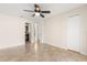 Spacious bedroom with two closets, ceiling fan, and an en-suite bathroom at 1208 Roma Ct, Orlando, FL 32825