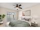 Comfortable bedroom with sliding glass doors leading to outdoor patio at 1208 Roma Ct, Orlando, FL 32825