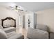 Bedroom featuring a ceiling fan, closet and tile floors at 1208 Roma Ct, Orlando, FL 32825