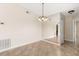 Inviting dining room with beautiful tile flooring and a modern chandelier fixture at 1208 Roma Ct, Orlando, FL 32825