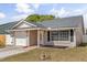 Charming single-story home with a one-car garage, complemented by a well-maintained yard and inviting front entrance at 1208 Roma Ct, Orlando, FL 32825
