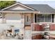Charming single-Gathering home featuring an attached garage, white trimmed windows, and well-maintained landscaping at 1208 Roma Ct, Orlando, FL 32825
