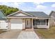 Charming single-story home with a one-car garage, complemented by a well-maintained yard and inviting front entrance at 1208 Roma Ct, Orlando, FL 32825