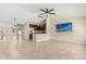 Spacious living room featuring a dining area and a modern kitchen with stainless steel appliances at 1208 Roma Ct, Orlando, FL 32825