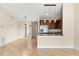 Open-concept living area with tile floors, and adjacent kitchen and dining spaces at 1208 Roma Ct, Orlando, FL 32825