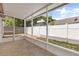 Enclosed patio with tile flooring and view of fenced backyard at 1208 Roma Ct, Orlando, FL 32825