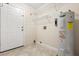 Utility room with shelving, water heater, and tile floor at 1208 Roma Ct, Orlando, FL 32825