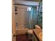 A bathroom featuring a shower with a blue curtain, a vanity with sink, and a toilet at 135 Pine Island Cir, Kissimmee, FL 34743