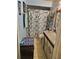 Bathroom with decorative shower curtain, vanity, and tiled floors at 135 Pine Island Cir, Kissimmee, FL 34743