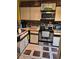 Efficient kitchen with stainless steel appliances, wooden accents, and ample counter space at 135 Pine Island Cir, Kissimmee, FL 34743