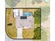 Overhead view of home featuring a private pool, fenced yard, and modern solar panels at 1594 Frances St, Kissimmee, FL 34744