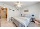 This cozy bedroom offers comfortable bedding, soft lighting, and ample storage with a closet at 1594 Frances St, Kissimmee, FL 34744
