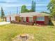 Inviting single-story house with brick accents, a well-kept lawn, and a welcoming front entrance at 1594 Frances St, Kissimmee, FL 34744
