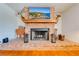 The brick fireplace has a wooden mantle with decorative accents and a brick hearth at 1594 Frances St, Kissimmee, FL 34744