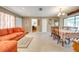 The living room has a cozy sofa and dining table, perfect for Gathering gatherings and relaxation at 1594 Frances St, Kissimmee, FL 34744