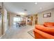 Spacious living room and dining room area featuring a large sliding glass door leading to the backyard at 1594 Frances St, Kissimmee, FL 34744