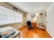 This cozy home office has hardwood floors, natural light, and ample room to work and create at 1594 Frances St, Kissimmee, FL 34744