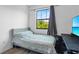 Cozy bedroom with a comfortable bed, a window, and natural light, perfect for relaxation at 1809 Portofino Meadows Blvd, Orlando, FL 32824