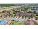 Beautiful townhome with brick driveway, attached garages, and lush landscaping in a well-maintained community at 1809 Portofino Meadows Blvd, Orlando, FL 32824