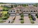 Beautiful townhome with manicured landscaping, brick accents, and private garages at 1809 Portofino Meadows Blvd, Orlando, FL 32824