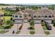 Beautiful townhome with manicured landscaping, brick accents, and private garages at 1809 Portofino Meadows Blvd, Orlando, FL 32824