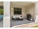 Cozy outdoor patio with comfortable seating, grill, and space for entertaining at 1809 Portofino Meadows Blvd, Orlando, FL 32824