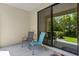 Relaxing covered patio area with comfortable seating and view of the yard at 1809 Portofino Meadows Blvd, Orlando, FL 32824