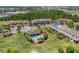 Aerial view of community pool, clubhouse and lush landscaping at 1809 Portofino Meadows Blvd, Orlando, FL 32824