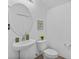 Stylish powder room featuring a pedestal sink, modern fixtures, and decorative accents at 1809 Portofino Meadows Blvd, Orlando, FL 32824