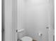 Simple half-bath featuring a modern toilet, towel paper rack, and a neutral color scheme at 1809 Portofino Meadows Blvd, Orlando, FL 32824