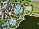 Aerial view of the pool and recreational area highlighting a large pool, playground, and lakeside access at 1817 Caribbean View Ter, Kissimmee, FL 34747