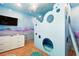 Themed bedroom featuring built in bed and cartoon wall decor at 1817 Caribbean View Ter, Kissimmee, FL 34747