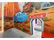 Whimsical 'Cars' themed room featuring custom painted walls with an arched entry to stairs at 1817 Caribbean View Ter, Kissimmee, FL 34747